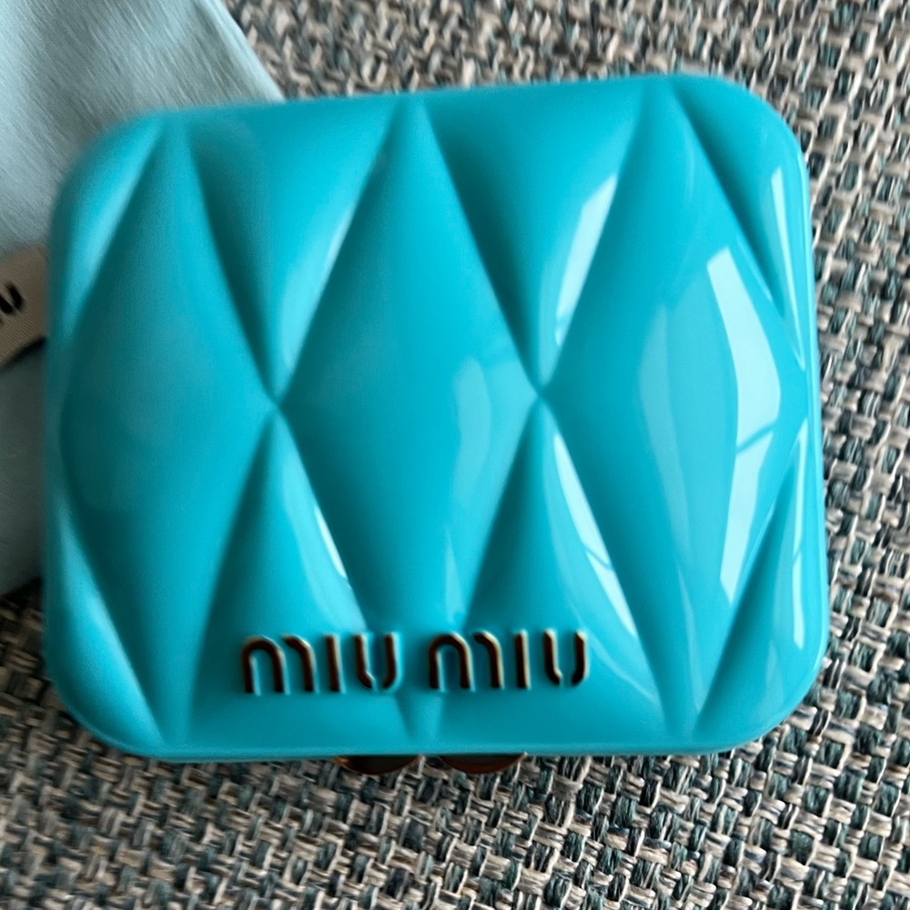 39. Miu Miu Turquoise Compact Case